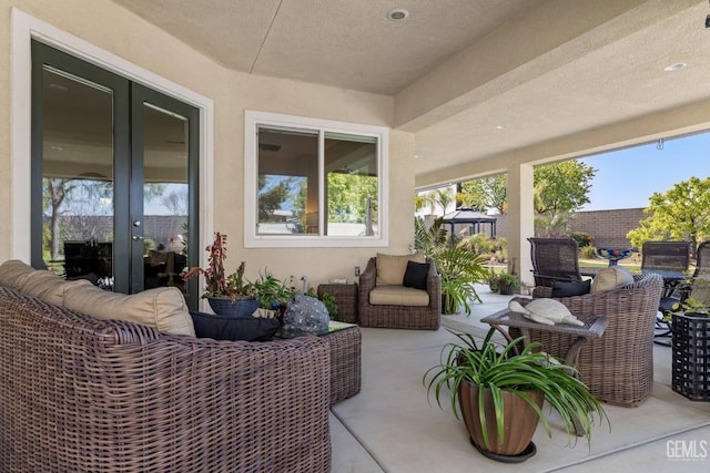 view of patio with french doors and outdoor lounge area