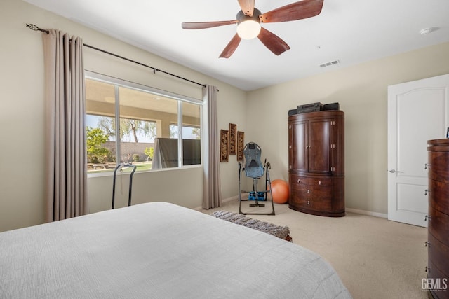 carpeted bedroom featuring visible vents, ceiling fan, and baseboards