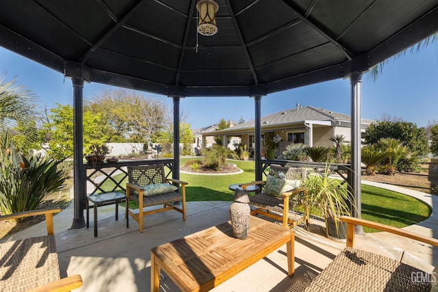 view of patio with outdoor dining space and a gazebo