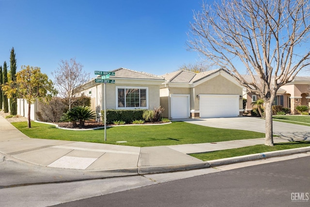 ranch-style home featuring stucco siding, a front yard, a garage, driveway, and a tiled roof