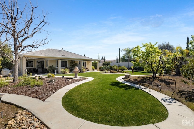 view of yard featuring a patio area and fence