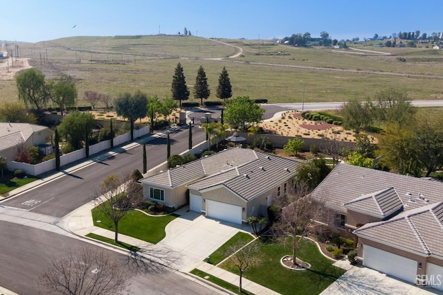 birds eye view of property with a rural view