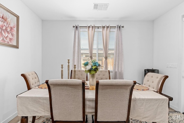 7900 Linden Tree Ave, Bakersfield, CA 93313 - dining room with wood finished floors, visible vents, and baseboards