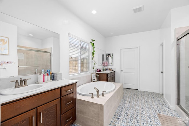 7900 Linden Tree Ave, Bakersfield, CA 93313 - full bath with a bath, visible vents, a sink, and a stall shower