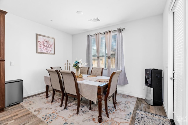 7900 Linden Tree Ave, Bakersfield, CA 93313 - dining space featuring light wood-style floors, visible vents, and baseboards