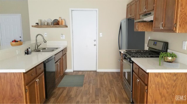9057 Mackenzie Ct, Bakersfield, CA 93306 - kitchen featuring gas range, a sink, exhaust hood, wood finished floors, and open shelves