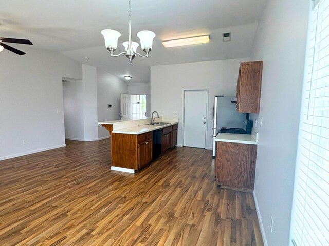 9057 Mackenzie Ct, Bakersfield, CA 93306 - kitchen with a sink, open floor plan, black dishwasher, dark wood-type flooring, and vaulted ceiling