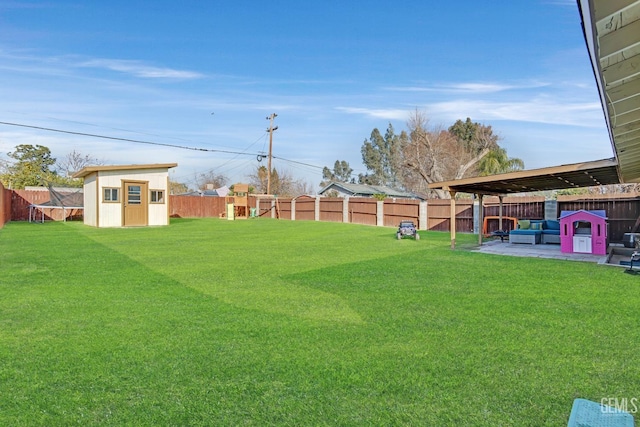 view of yard with a patio area, an outdoor living space, and a shed