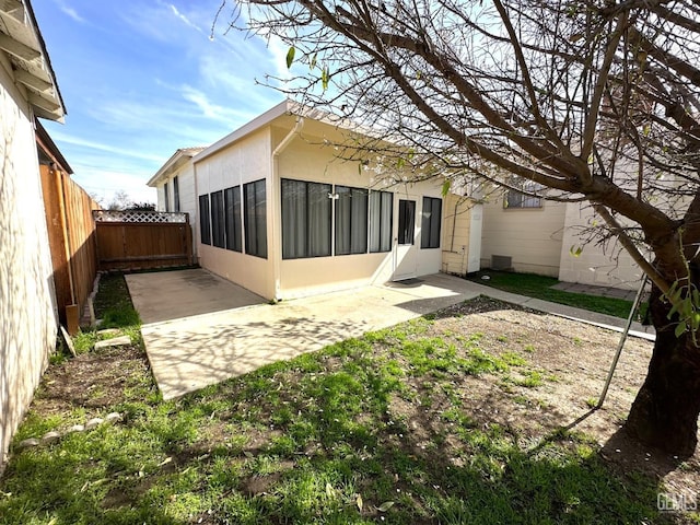 615 Cypress St, Bakersfield, CA 93304 - rear view of property with a patio and a fenced backyard