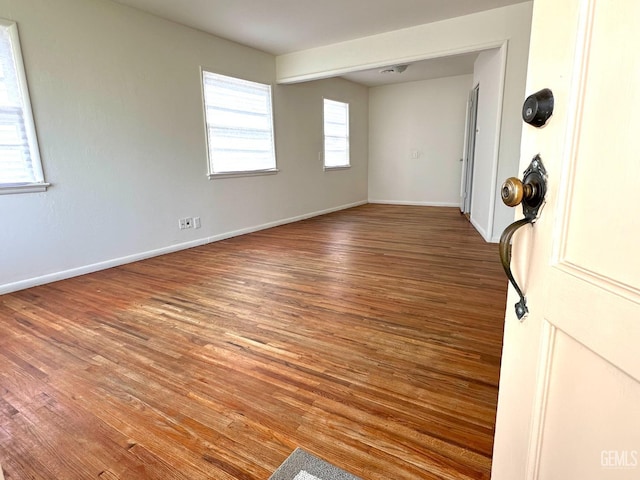 615 Cypress St, Bakersfield, CA 93304 - empty room with wood finished floors and baseboards