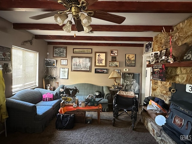 living area with beamed ceiling, carpet flooring, and ceiling fan