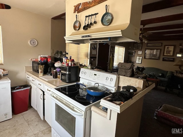 kitchen with white cabinets, electric range, ceiling fan, and light tile patterned flooring