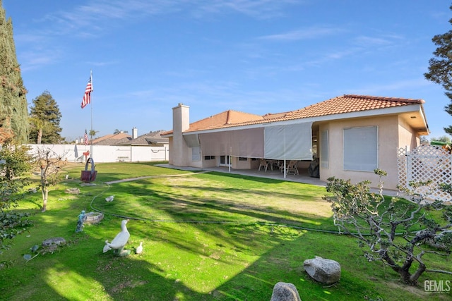 view of yard with a patio area and a fenced backyard