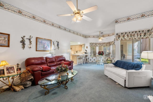 living room with a ceiling fan and carpet flooring