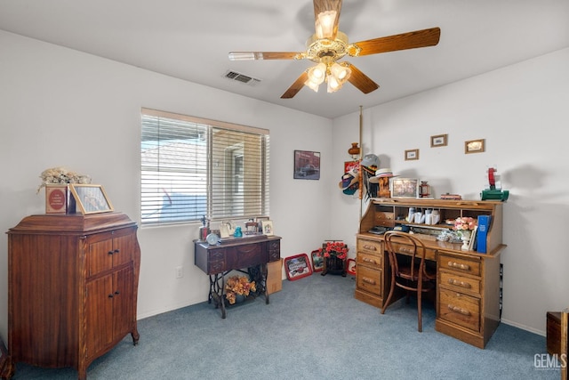 carpeted office featuring visible vents and ceiling fan