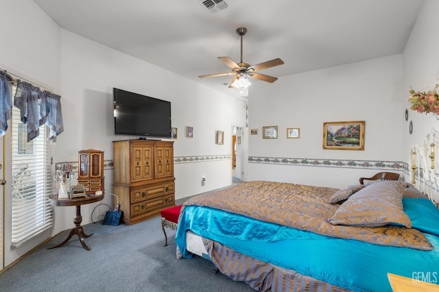 carpeted bedroom featuring visible vents and ceiling fan