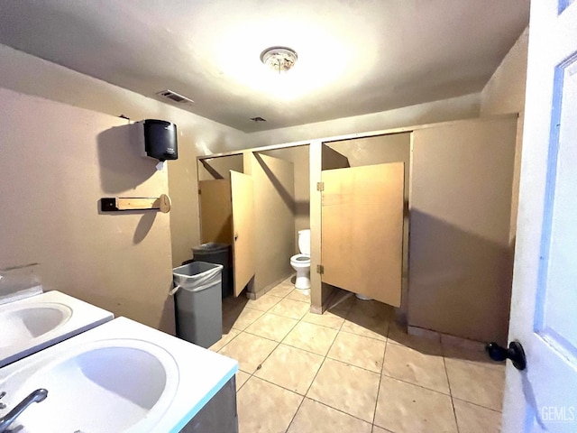 full bath with toilet, visible vents, tile patterned floors, and vanity