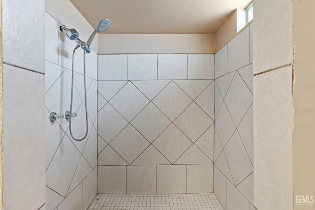 full bathroom with tiled shower