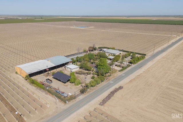 birds eye view of property with a rural view