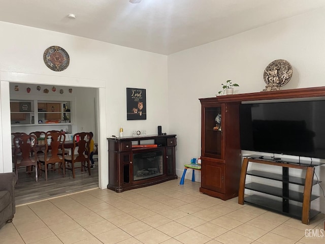 living area featuring light tile patterned flooring
