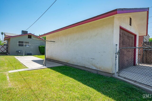819 P St, Bakersfield, CA 93304 - view of side of home with a patio and stucco siding