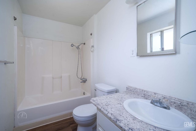819 P St, Bakersfield, CA 93304 - full bathroom featuring toilet, shower / tub combination, vanity, and wood finished floors
