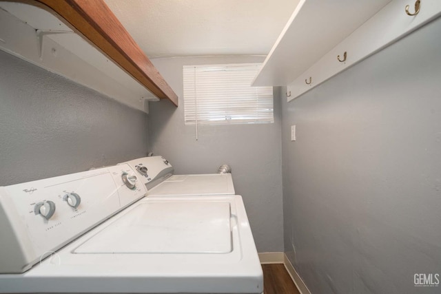 819 P St, Bakersfield, CA 93304 - laundry room featuring washer and dryer, dark wood finished floors, and baseboards