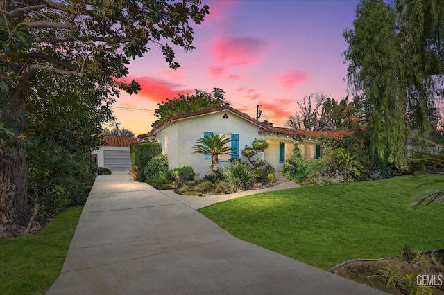 mediterranean / spanish-style home with a yard