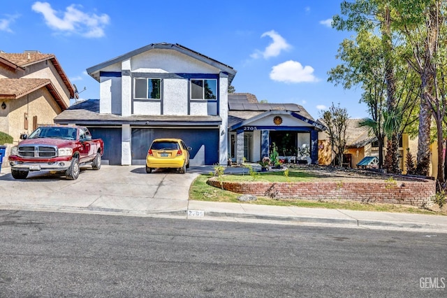 2705 Puder St, Bakersfield, CA 93306 - traditional-style house featuring stucco siding, concrete driveway, a garage, and solar panels