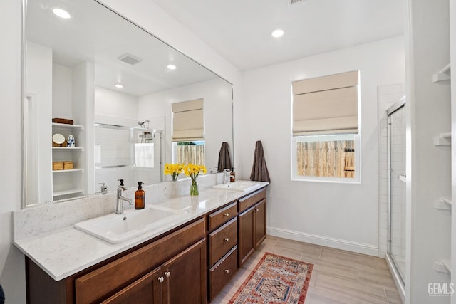 6713 Diamond Springs Dr, Bakersfield, CA 93313 - bathroom featuring a shower stall, baseboards, plenty of natural light, double vanity, and recessed lighting
