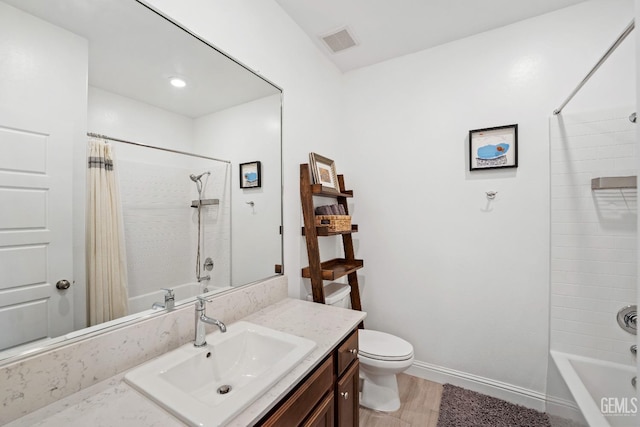 6713 Diamond Springs Dr, Bakersfield, CA 93313 - bathroom with shower / tub combo, toilet, vanity, wood finished floors, and baseboards