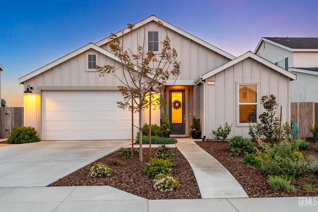 6713 Diamond Springs Dr, Bakersfield, CA 93313 - view of front facade featuring board and batten siding, a garage, fence, and concrete driveway