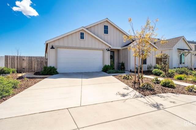 6713 Diamond Springs Dr, Bakersfield, CA 93313 - view of front of property featuring board and batten siding, fence, a garage, and driveway