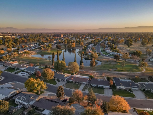 aerial view at dusk with a water view