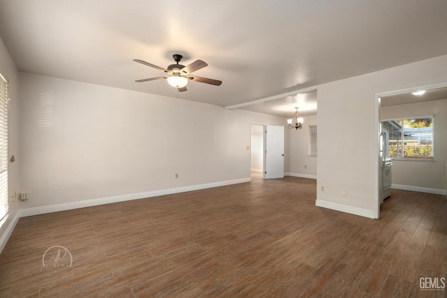 unfurnished room featuring dark hardwood / wood-style floors and ceiling fan with notable chandelier