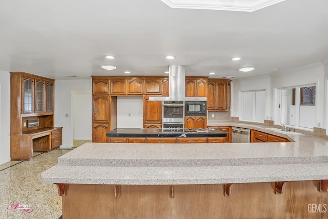 kitchen with brown cabinetry, extractor fan, appliances with stainless steel finishes, a sink, and crown molding