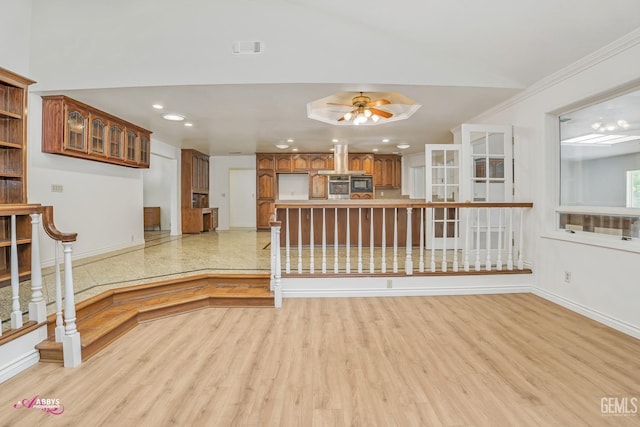 unfurnished living room with light wood-type flooring, recessed lighting, a ceiling fan, and baseboards