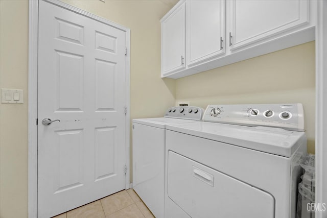 10002 Riata Ln, Bakersfield, CA 93306 - washroom with washer and dryer, cabinet space, and light tile patterned floors