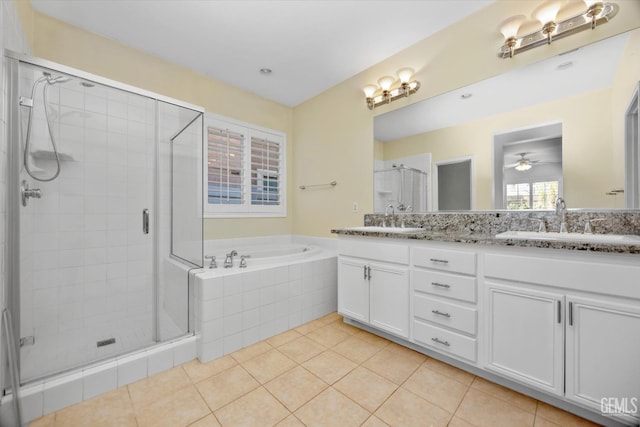 10002 Riata Ln, Bakersfield, CA 93306 - bathroom featuring a shower stall, a garden tub, double vanity, tile patterned flooring, and ceiling fan