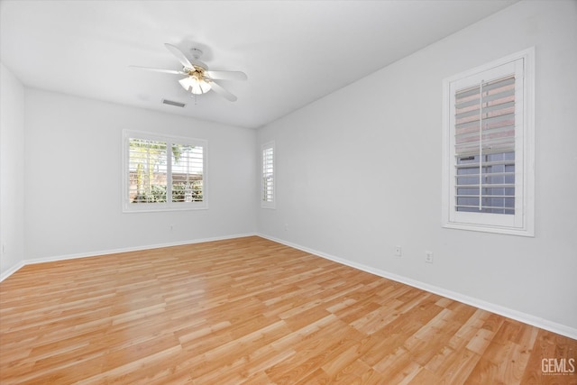 10002 Riata Ln, Bakersfield, CA 93306 - empty room featuring light wood-style floors, a ceiling fan, and baseboards