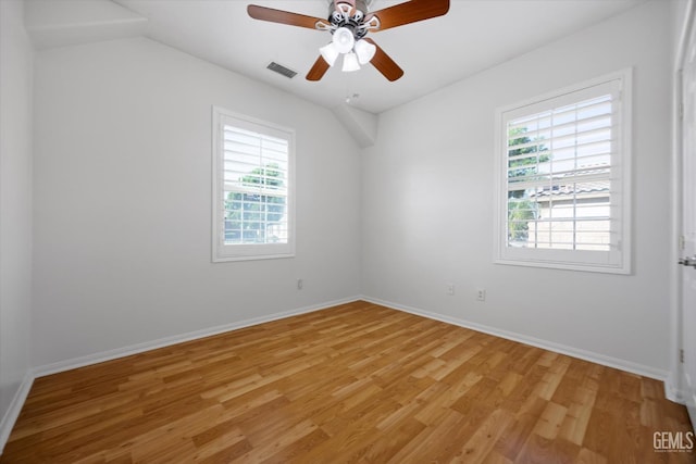 10002 Riata Ln, Bakersfield, CA 93306 - unfurnished room with plenty of natural light, light wood-style floors, a ceiling fan, baseboards, and vaulted ceiling