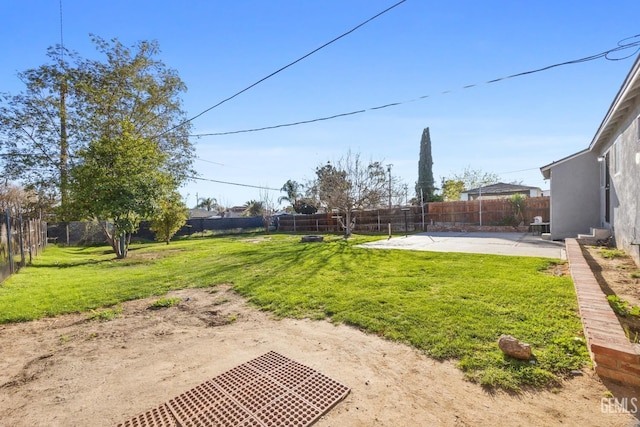 view of yard with a patio area and a fenced backyard