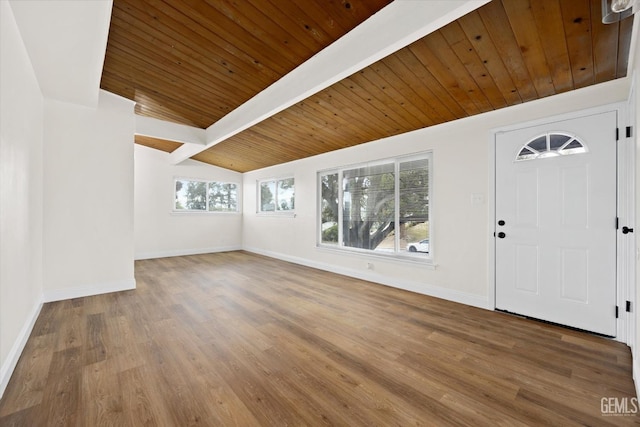 entryway with vaulted ceiling with beams, wood-type flooring, and wooden ceiling