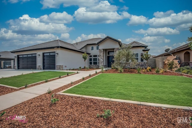 view of front facade with a garage and a front yard