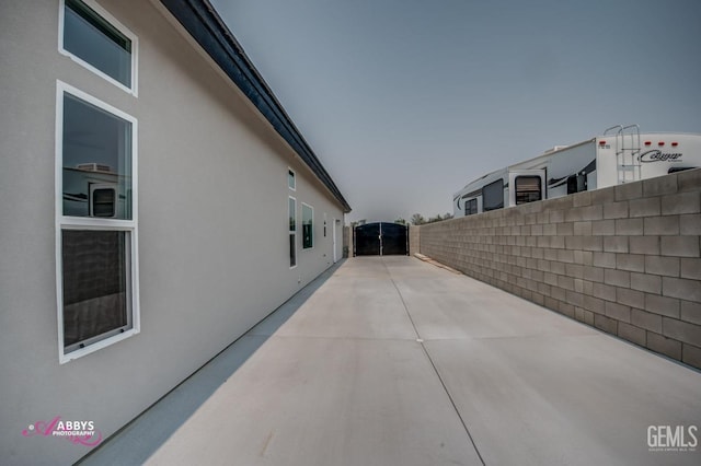 property exterior at dusk with a patio