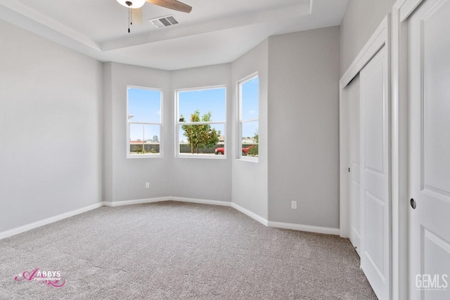 unfurnished bedroom featuring ceiling fan and carpet