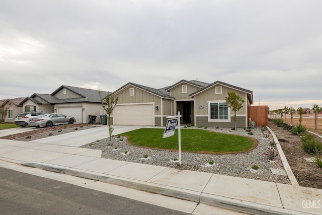 ranch-style home featuring a garage and a front lawn