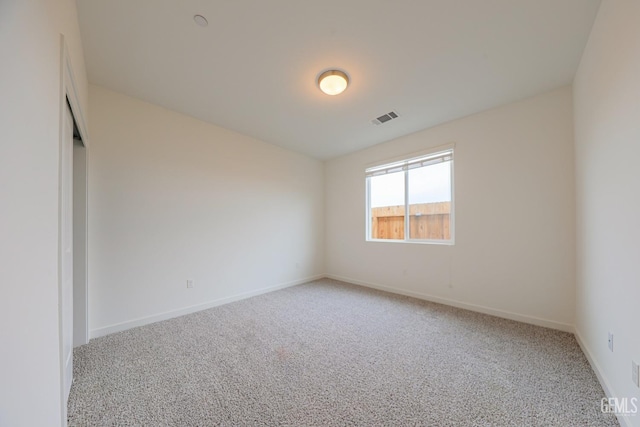 unfurnished room with carpet flooring