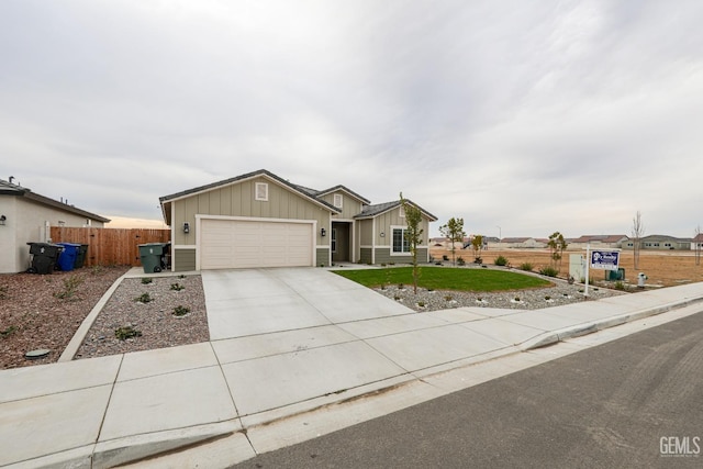 ranch-style house featuring a front yard and a garage