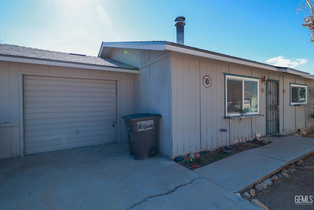 view of home's exterior with driveway and an attached garage